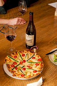 Chef Kim Mahan's pizzas are crowd pleasers at Burnt Bridge in downtown Vancouver, Wash.