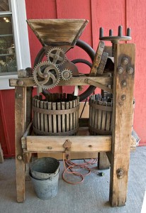 Old-fashioned apple cider press used in making hard cider.