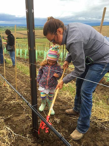 Pambrun Vineyard Manager Sadie Drury and her daughter Brin plant a Cabernet Sauvignon vine together at the Pambrun Groundbreaking Celebration on Sunday, May 15, 2016