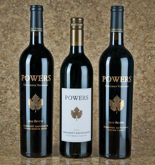 Powers 2010 Reserve Champoux Vineyard Cabernet Sauvignon Powers has been working with fruit from this intense and expressive Horse Heaven Hills vineyard since 1992. Aged 33 months in French oak barrels, this Cab exudes power, grace and balance. Nose: Brambly red berries and dark fruit aromas, with lovely shadings of cedar, cocoa powder and fennel. Taste: Elegant and finely balanced, with disarming power behind a swath of velvet tannins and rich core of dark fruit—black cherry, dark plum and black raspberry—nuanced with bittersweet dark chocolate and loamy earth on the long finish. 823 cases. $35 Powers 2013 Columbia Valley Cabernet Sauvignon A best-buy blend of no less than eight different Columbia Valley vineyards. This easy going Cab (88%) is rounded out with Merlot, Cabernet Franc, Syrah and Malbec. Nose: Aromas of blackberry, boysenberry, black plum, currant, mulberry leaf and a dash of white pepper. Taste: Smooth and round, with jammy flavors of blackberry, blueberry and molasses shaded with black tea, herbal red pepper and a dash of clove and tobacco spice on the finish. 6,250 cases. $15 Powers 2010 Reserve Sheridan Vineyard Cabernet Sauvignon Aged 32 months in French oak barrels, this Cab displays a stellar balance of acidity and fruit. It’s the third release from this well-respected Yakima Valley vineyard site. Nose: Lush aromatics of blue and red fruit, malted milk chocolate, graphite and anise-lemon chervil herb. Taste: Vibrant, expressive and muscular, with red currants, red cherry, black raspberry, mint, tea leaf and savory dried herb sachet. Thick chalky tannins persist endlessly on the finish. 515 cases. $30