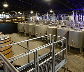 Encompassing more than 32,000 square feet in a space that was formerly a Dr. Pepper bottling plant, Charles Smith Wines Jet City bills itself as the largest urban winery on the West Coast. Photo by Charles Smith Wines.